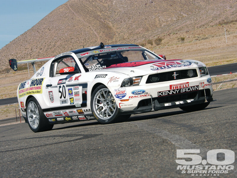 White Race Car on Track — Dynamic, Afternoon, Photograph, Race Car, Mountain