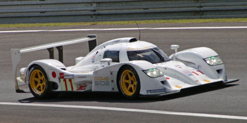 White Race Car on Track — Dynamic, Afternoon, Photograph, Race Car, Wings