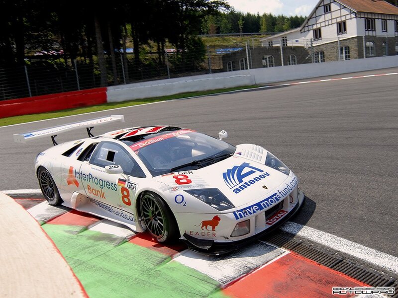 White Race Car on Track — Dynamic, Afternoon, Photograph, Race Track, Building