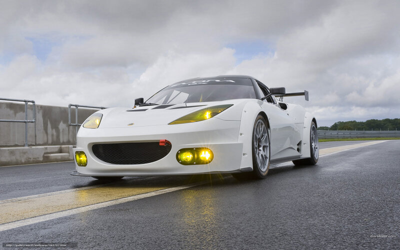 White Race Car on Track — Dynamic, Afternoon, Photograph, Race Track, Cloudy Sky