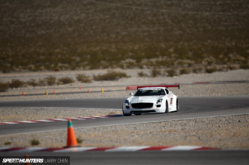 White Race Car on Track — Dynamic, Afternoon, Photograph, Race Track, Cone