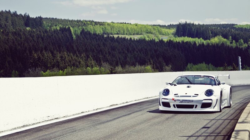 White Race Car on Track — Dynamic, Afternoon, Photograph, Race Track, Forest, Wall