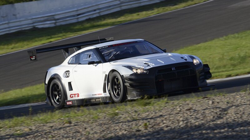 White Race Car on Track — Dynamic, Afternoon, Photograph, Race Track, Grass