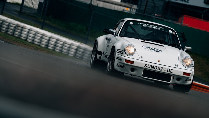 White Race Car on Track — Dynamic, Photograph, Race Car, Tire Barrier