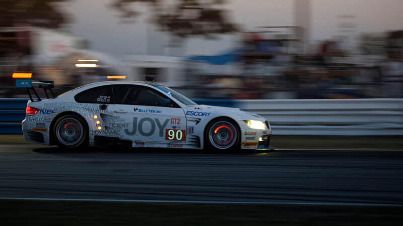 White Race Car on Track — Dynamic, Sunset, Photograph, Race Car, Guardrail