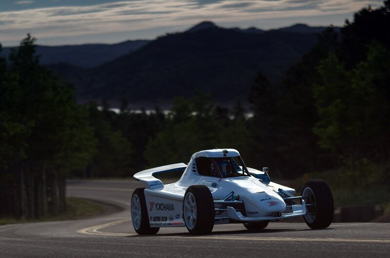 White race car on winding road