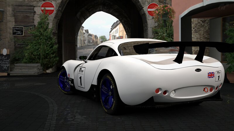 white race car under archway