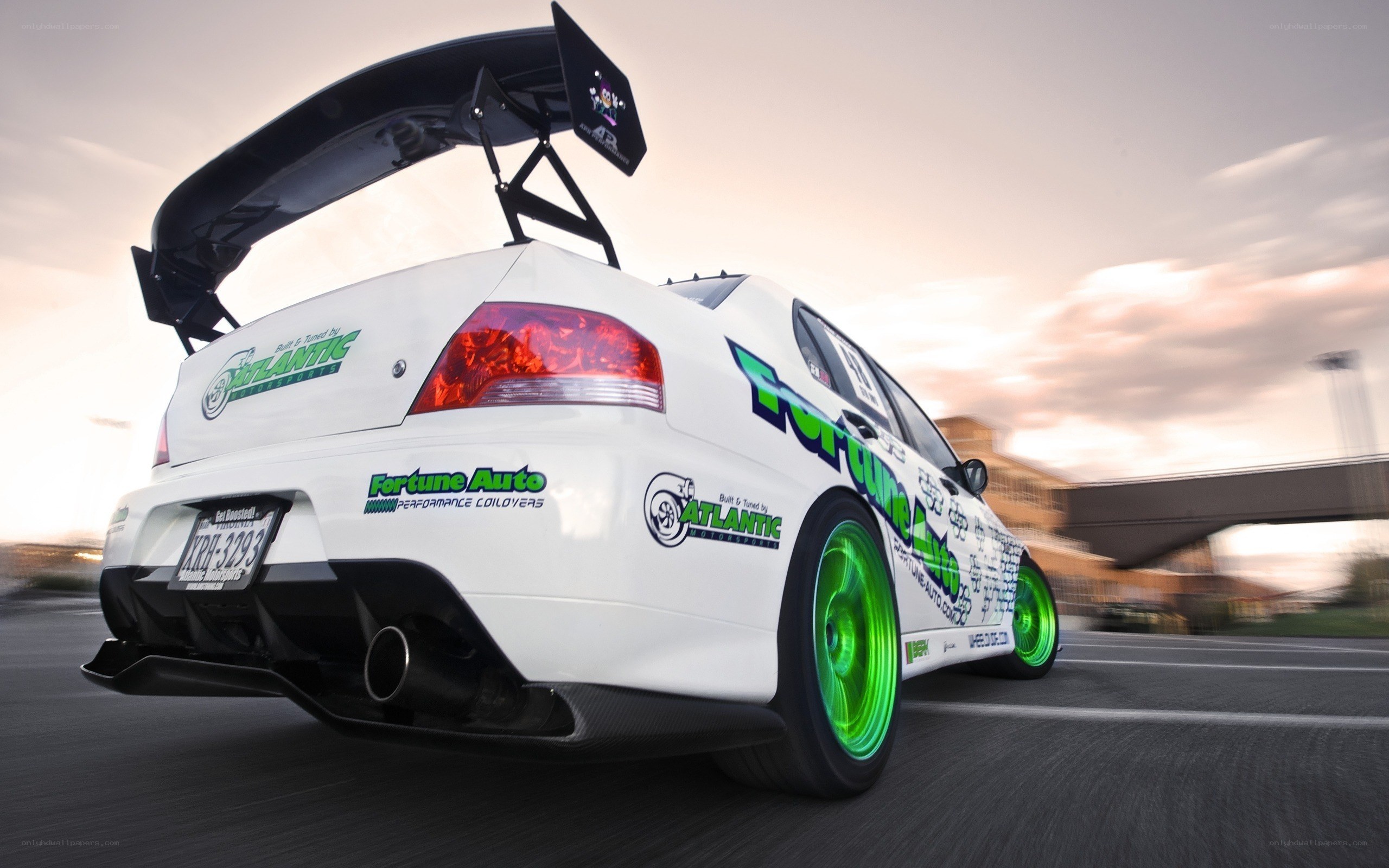 white race car with green wheels