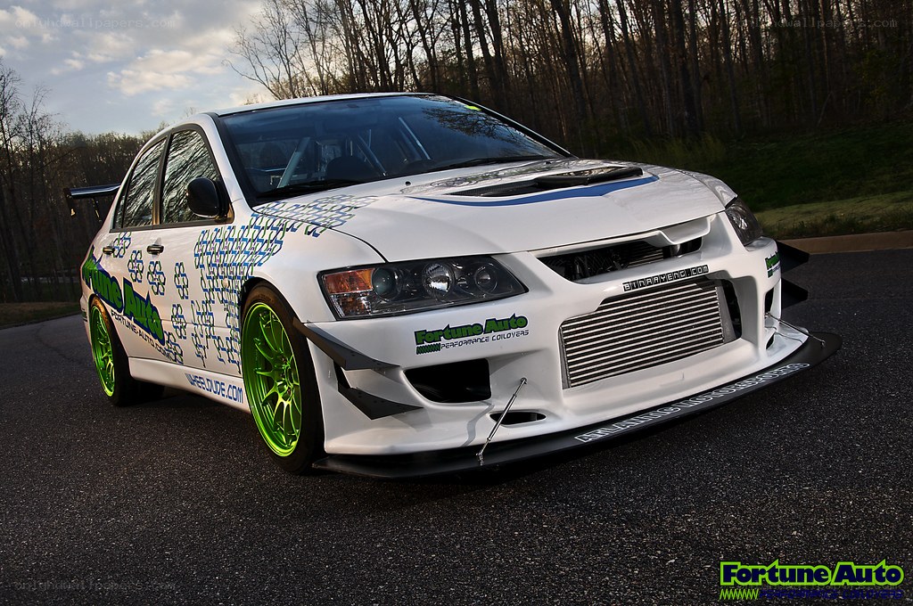 white race car with green wheels
