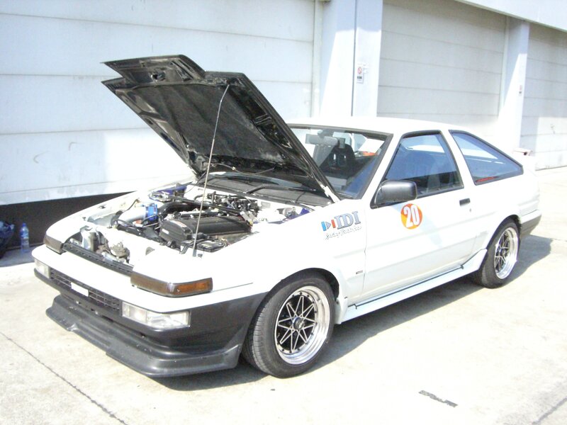 white race car with open hood