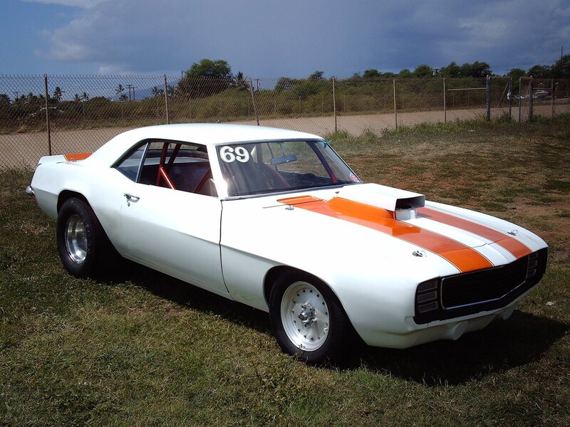 white race car with orange stripes