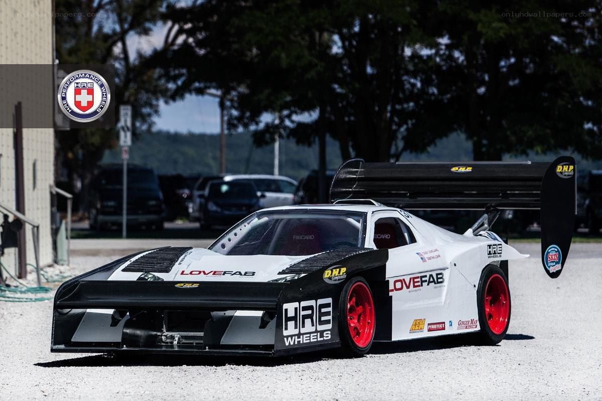 white race car with red wheels