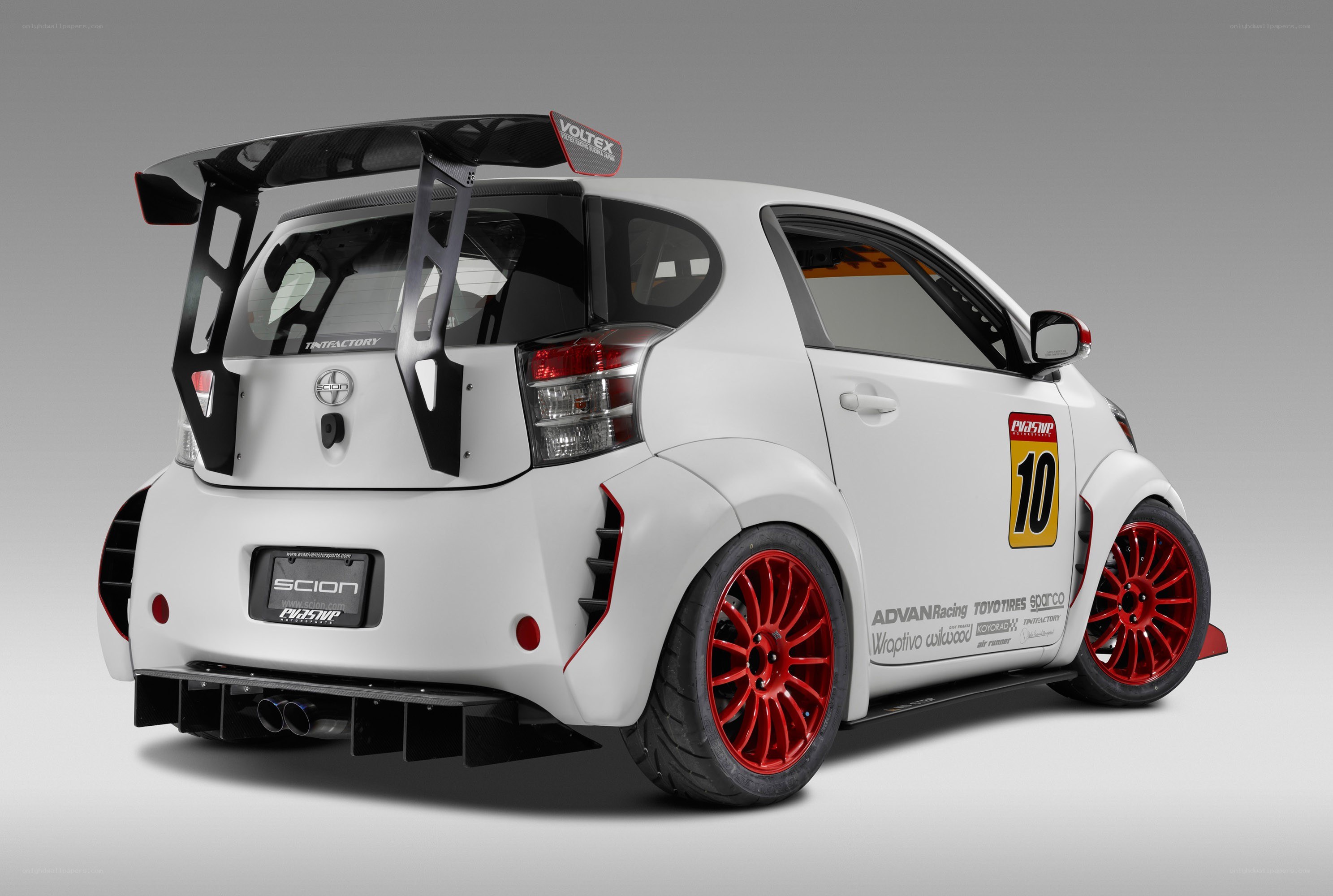 white race car with red wheels