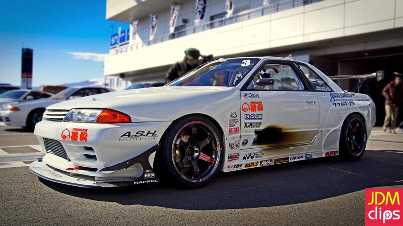 White race car with sponsor decals