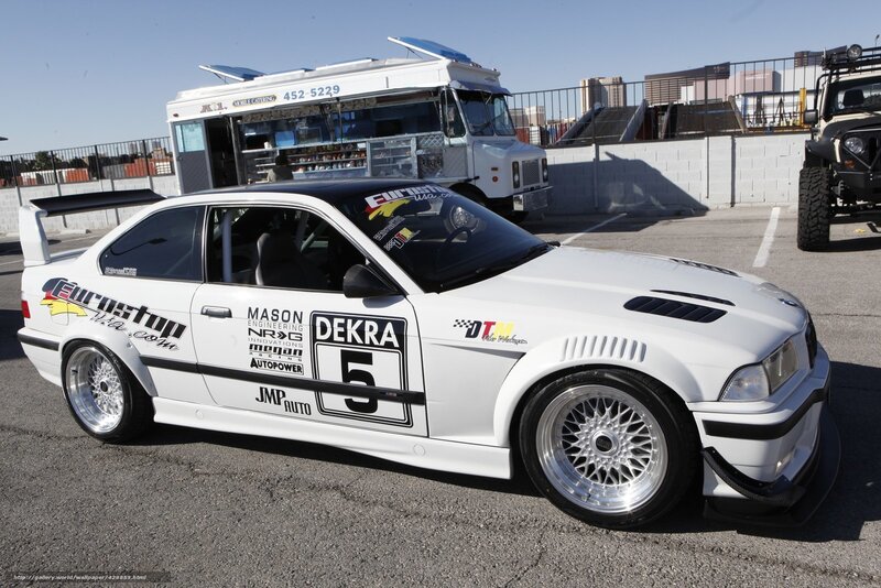 white race car with sponsor decals