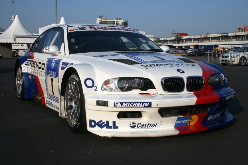 white race car with sponsor logos