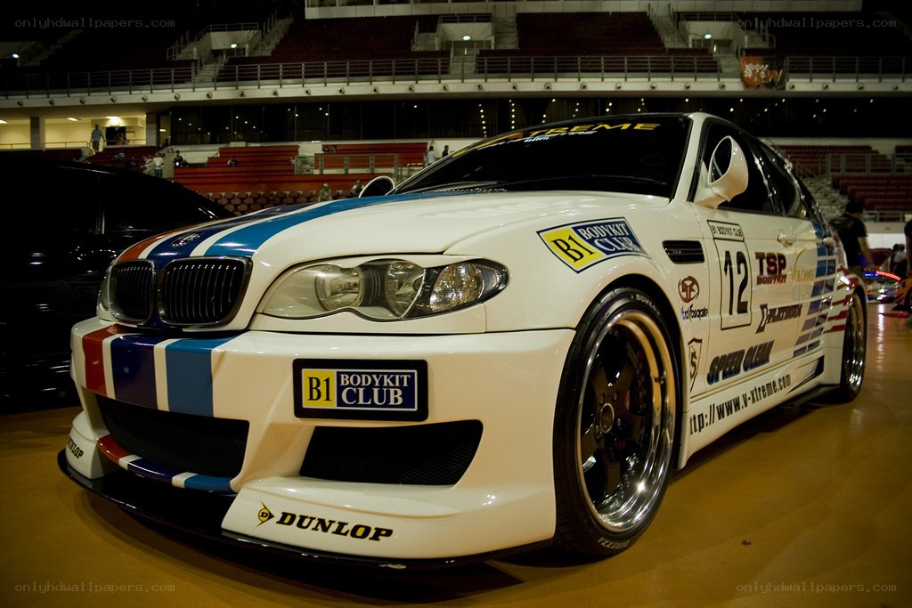 white race car with stripes