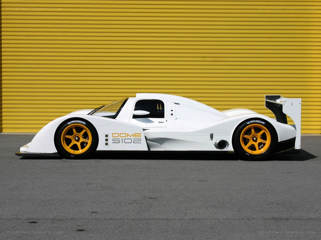 White race car with yellow wheels