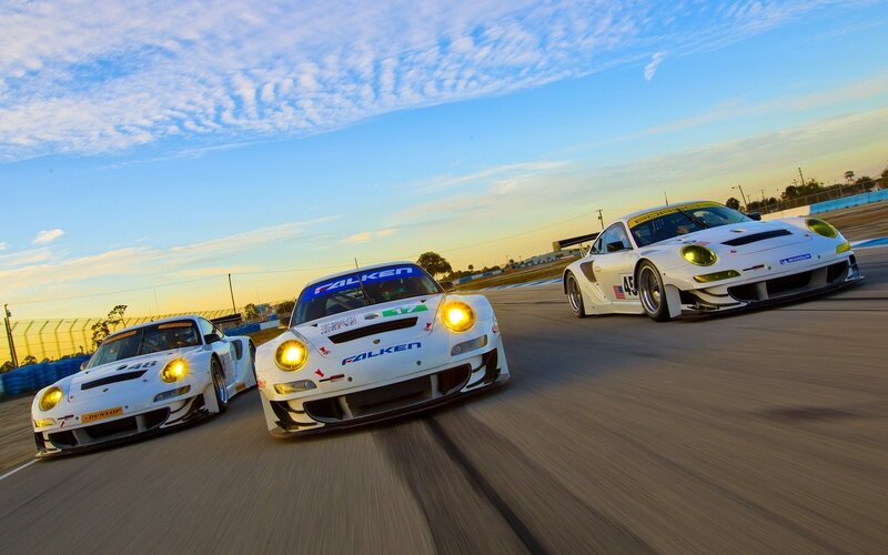 White race cars on track