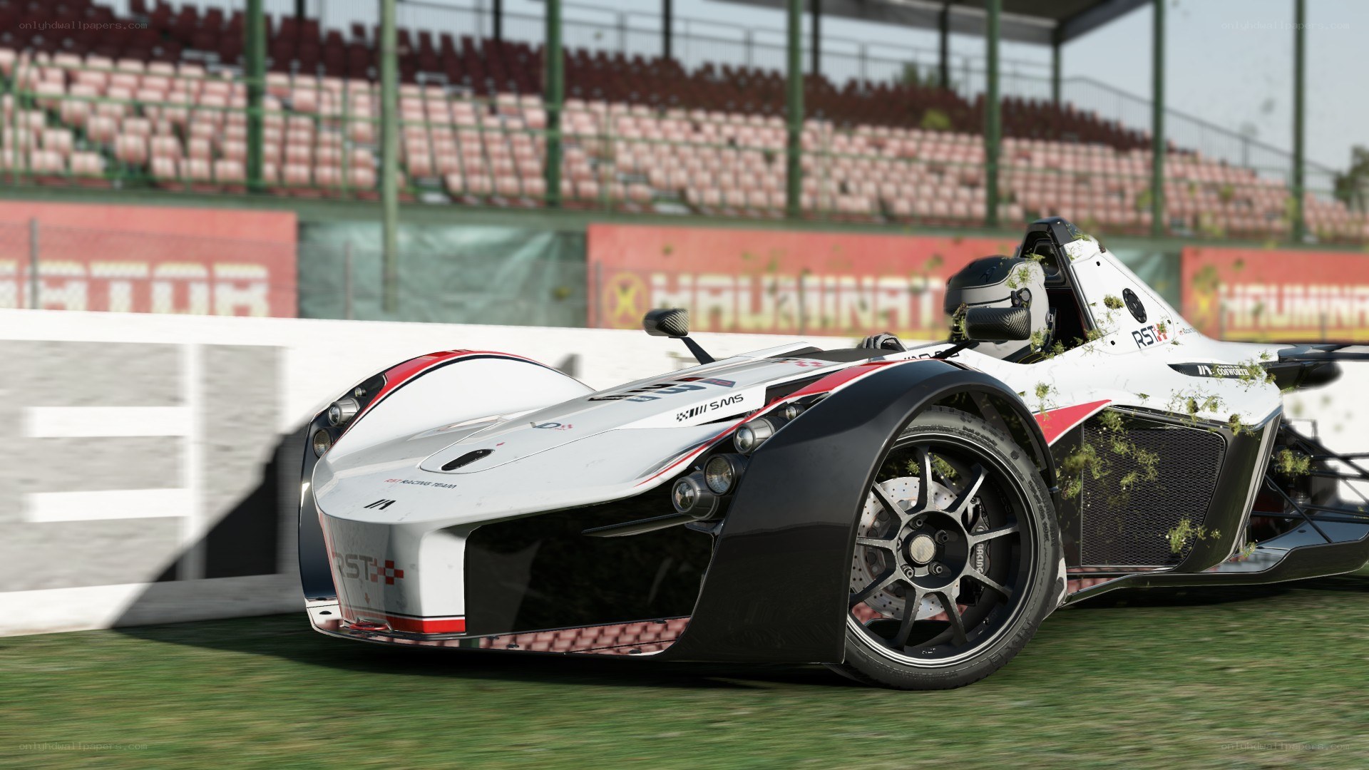 White racing car on grass