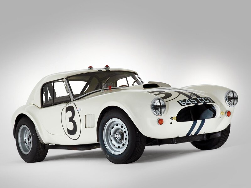 White racing car with number three