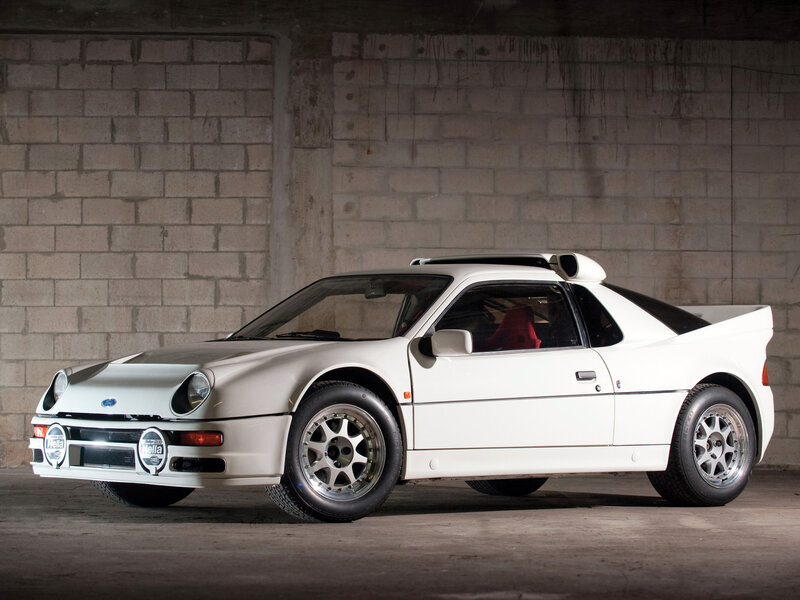 White Rally Car — Dramatic, Photograph, Brick Wall