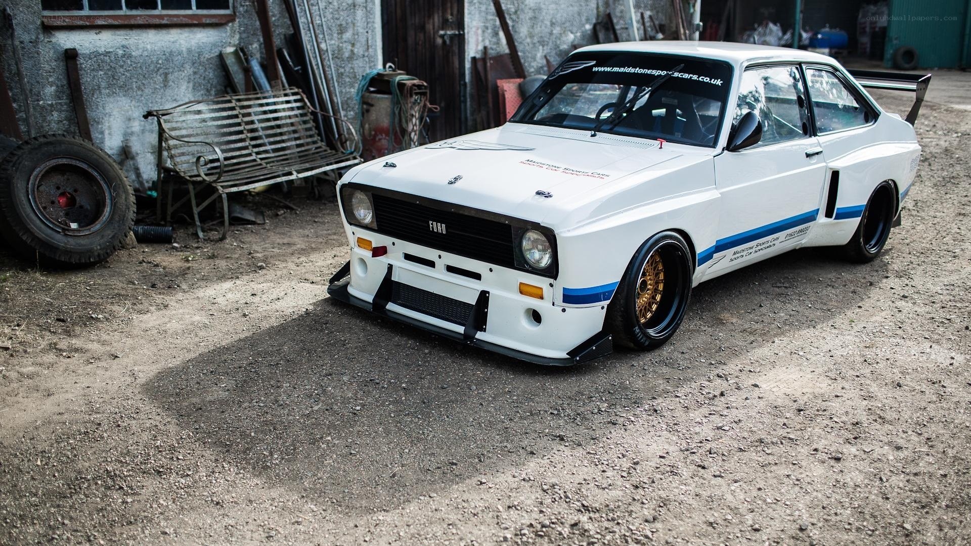 white rally car in garage