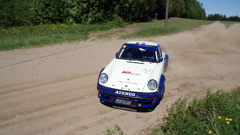 White Rally Car on Dirt — Dynamic