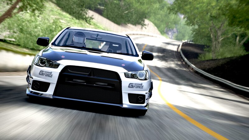 white rally car on winding road