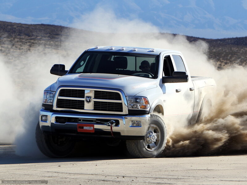 white ram truck kicking up dust