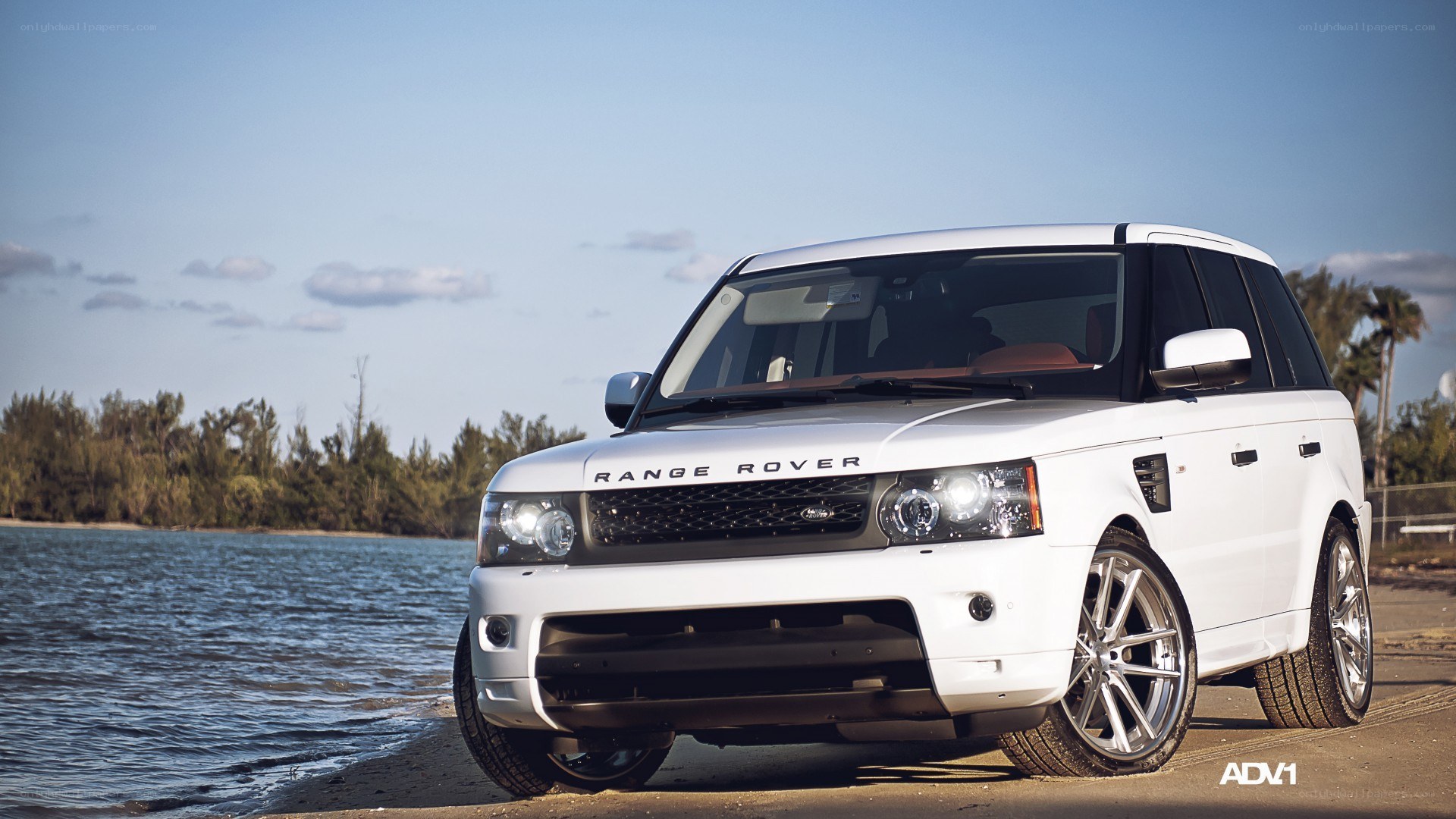 White Range Rover by the water
