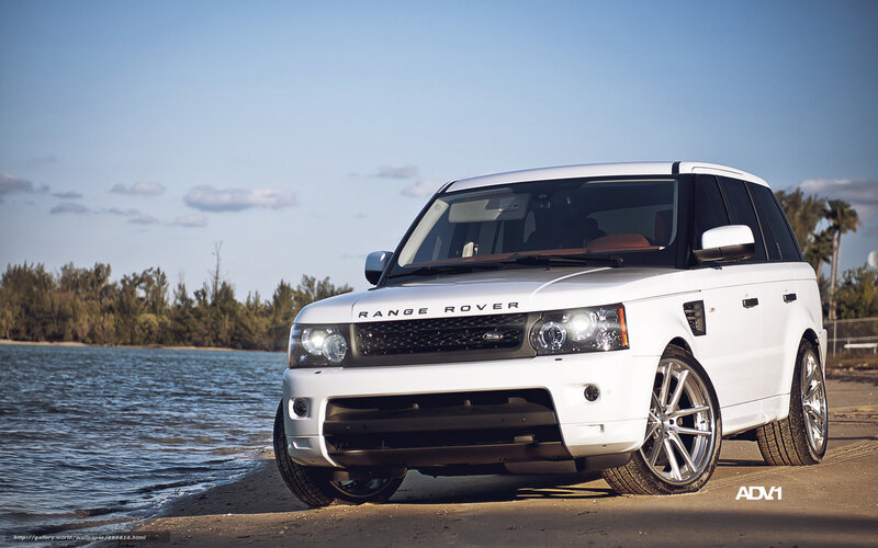 White Range Rover by water