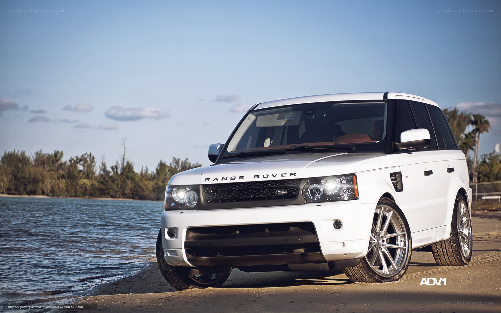 White Range Rover by water