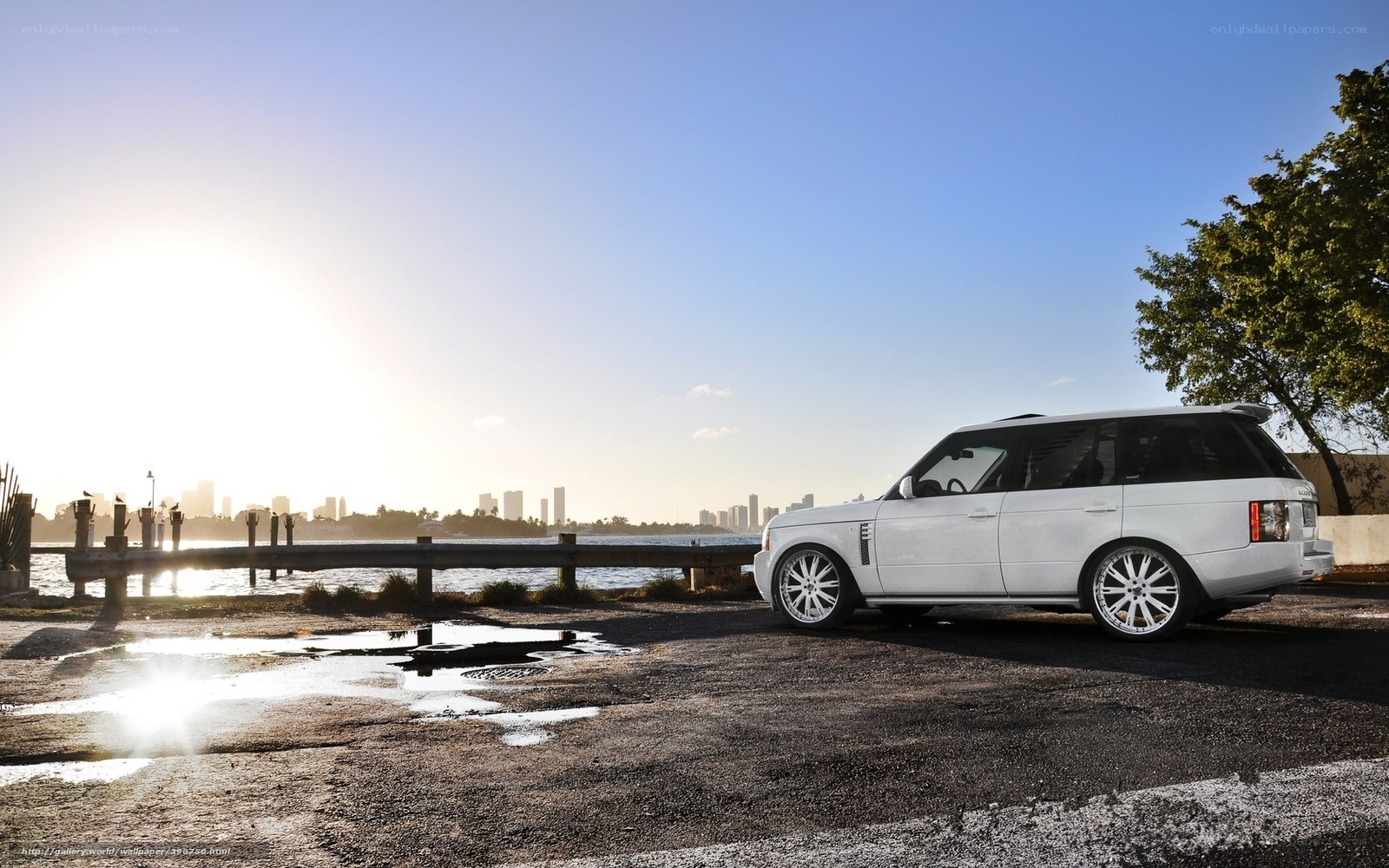 White Range Rover by waterfront