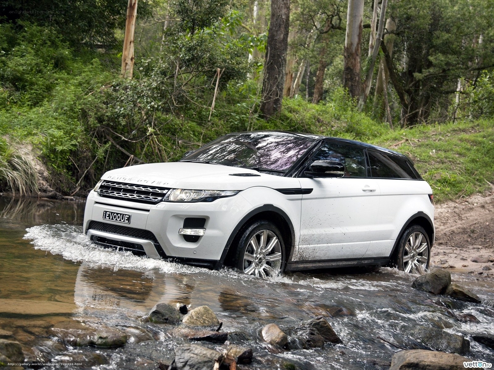 White Range Rover Evoque crossing stream