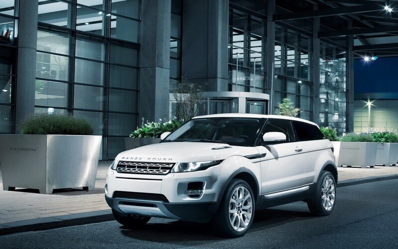 White Range Rover Evoque — Dramatic, Night, Photograph, Building, Planter, Street