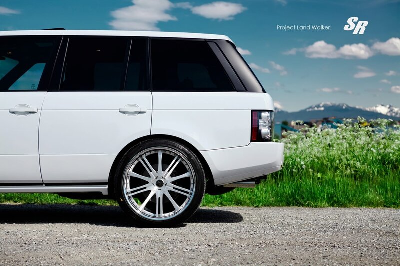 White Range Rover in a field