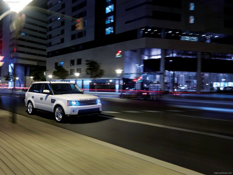 White Range Rover in city at night