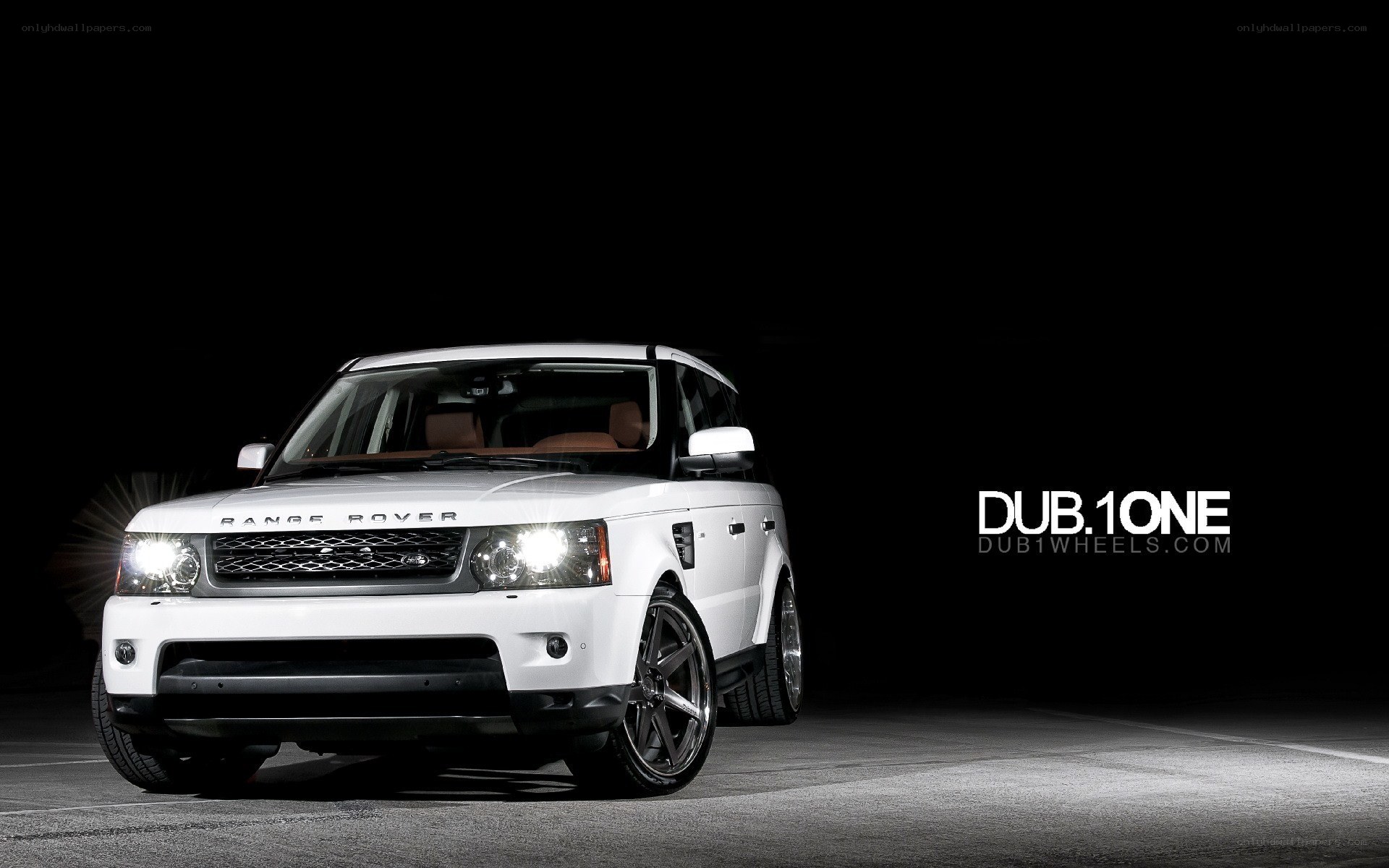 White Range Rover in dark setting