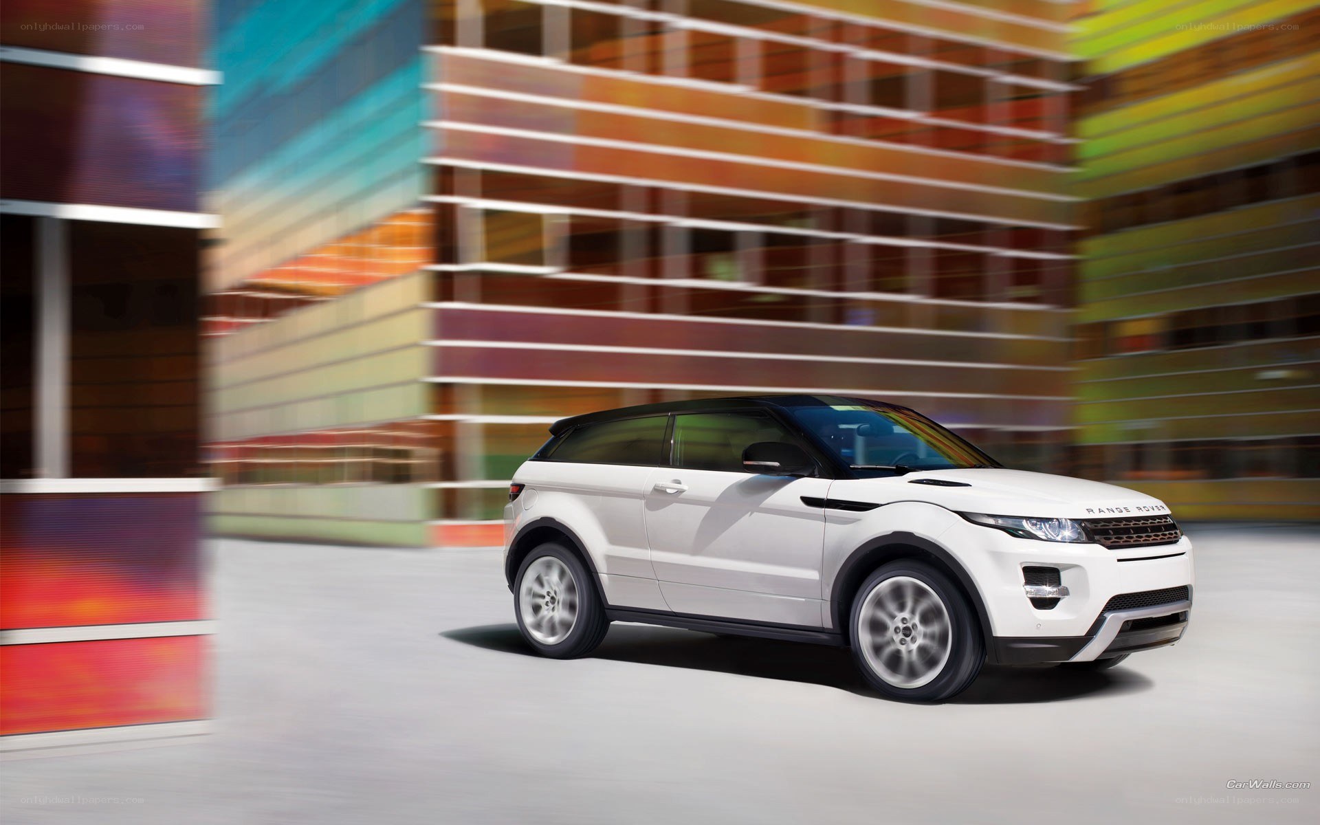 White Range Rover in motion