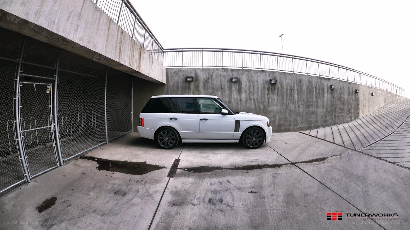 white range rover in parking area