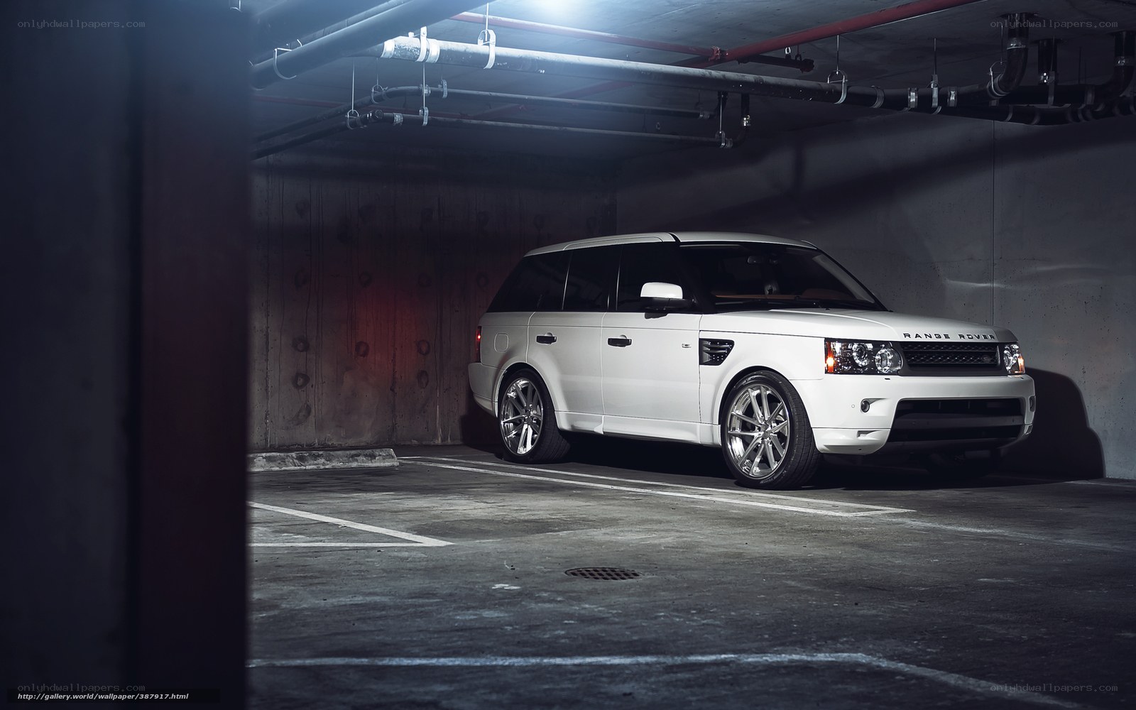 White Range Rover in parking garage