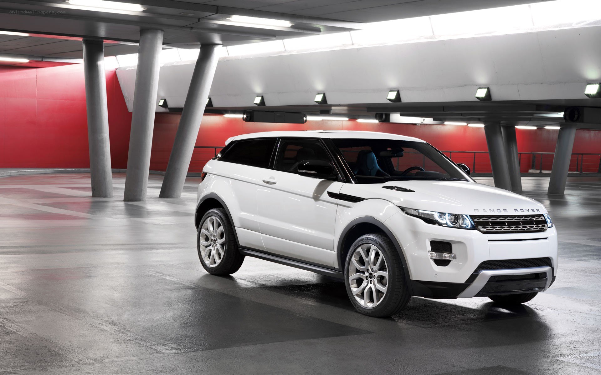 White Range Rover in parking garage