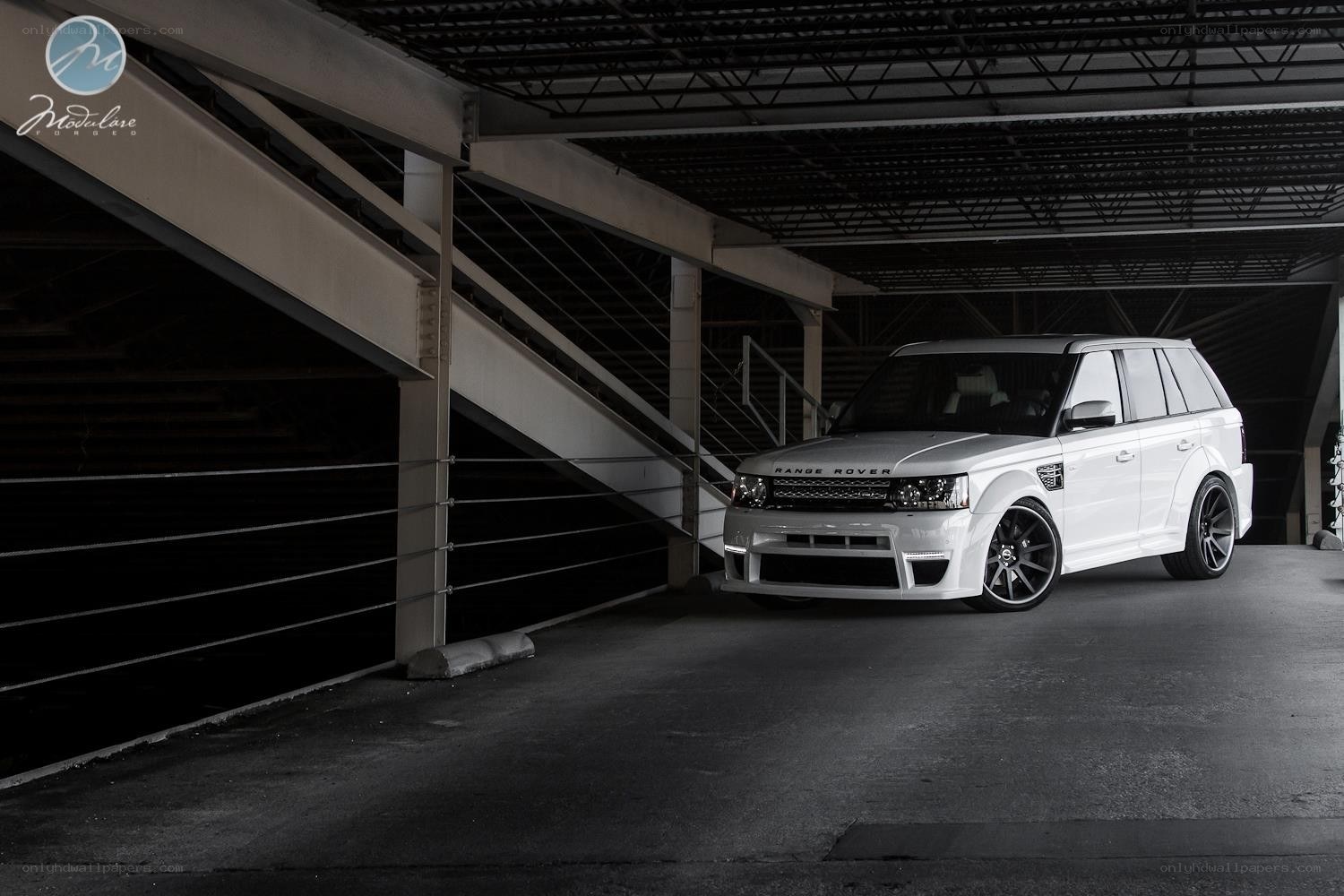 White Range Rover in parking garage