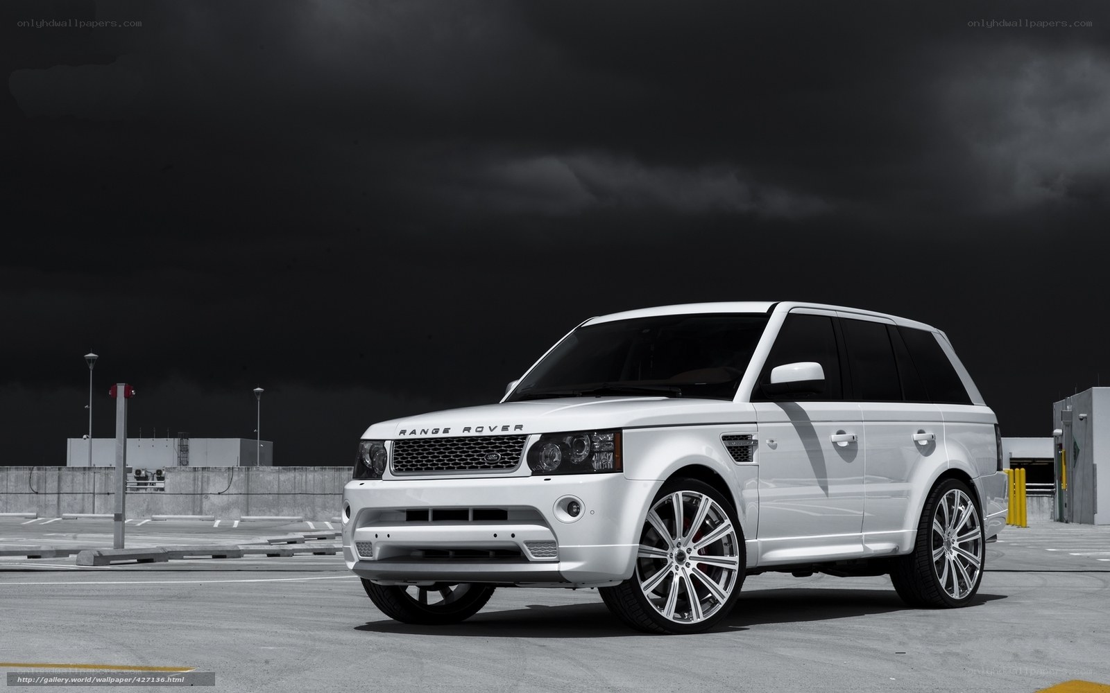White Range Rover in parking lot
