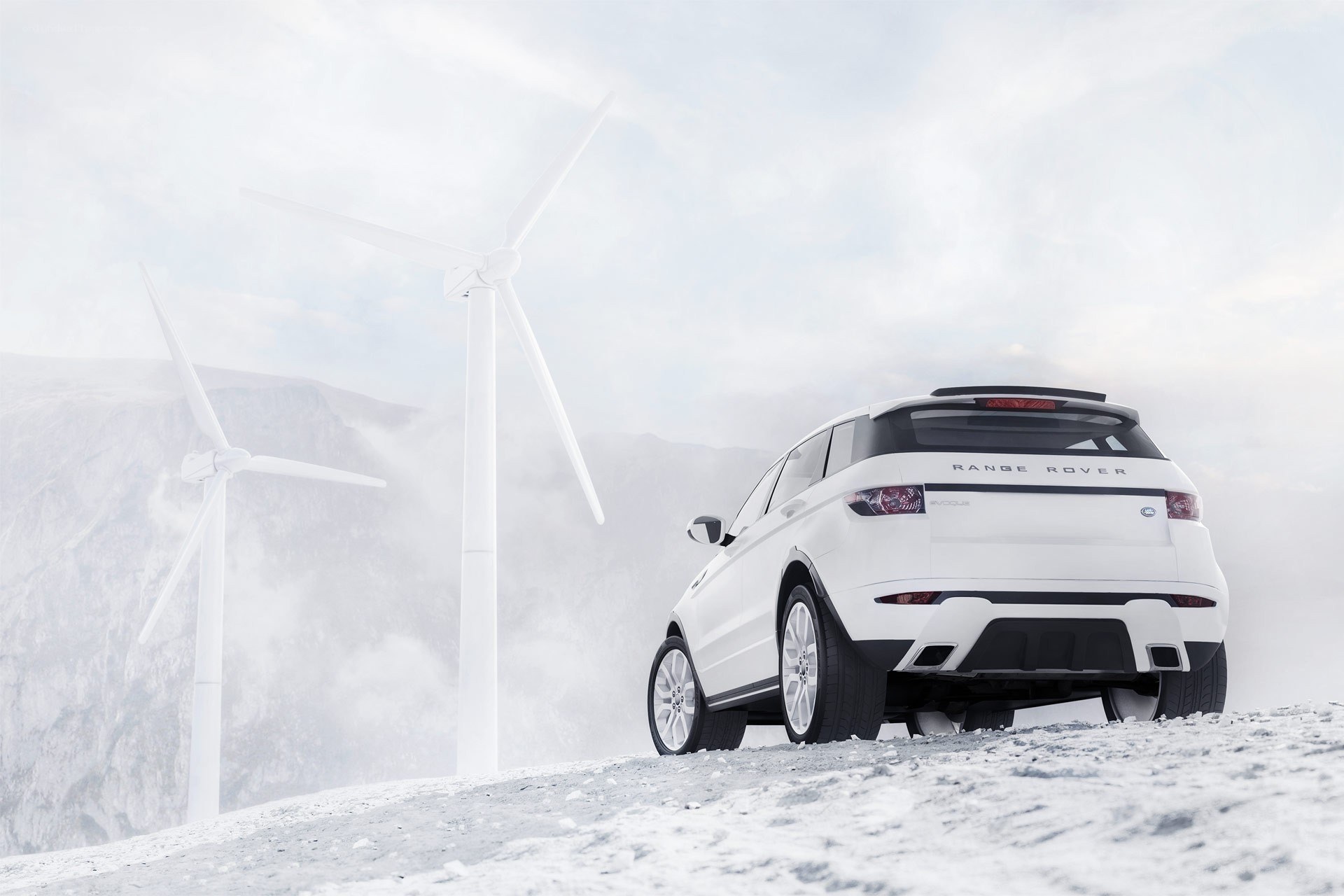 White Range Rover in snowy landscape
