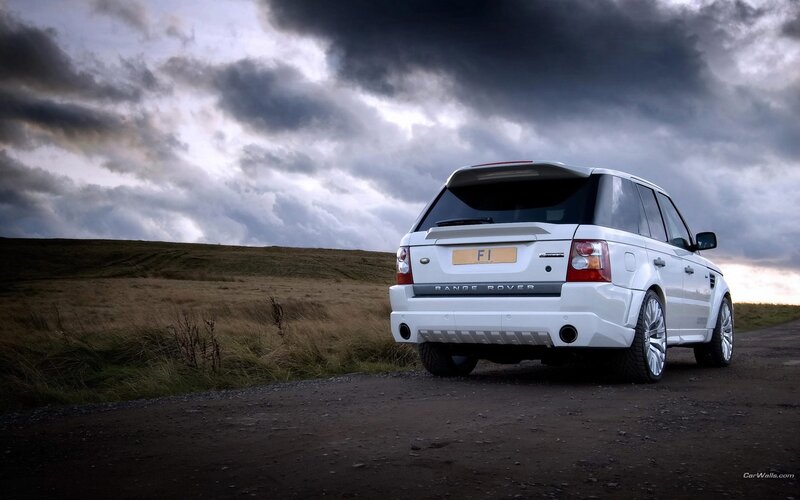 White Range Rover on a country road