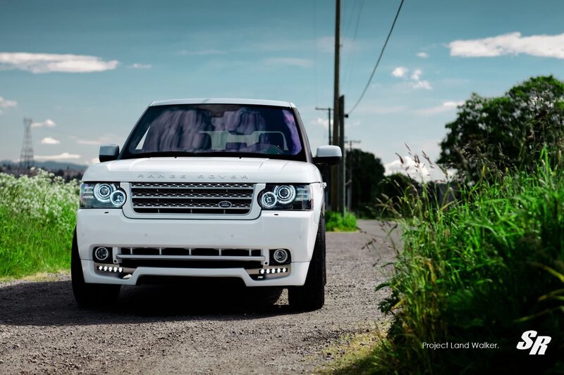 White Range Rover on a country road