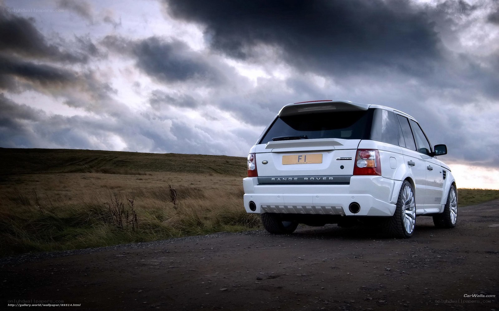 White Range Rover on a country road