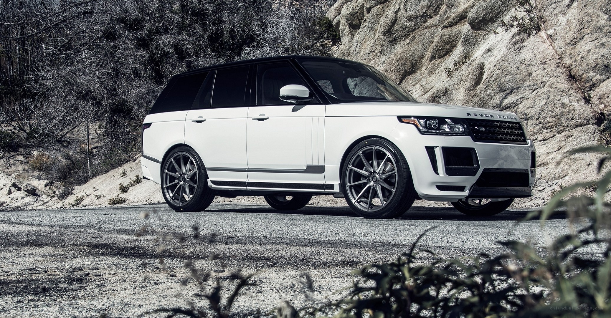 White Range Rover on a mountain road